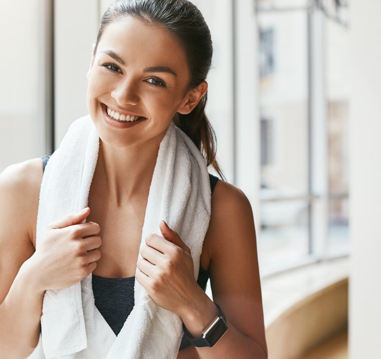Happy smiling woman after a stress-free wellness scan